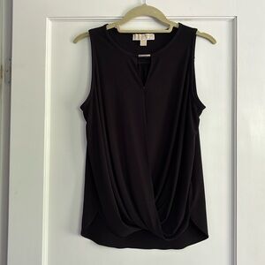 Black sleeveless blouse.